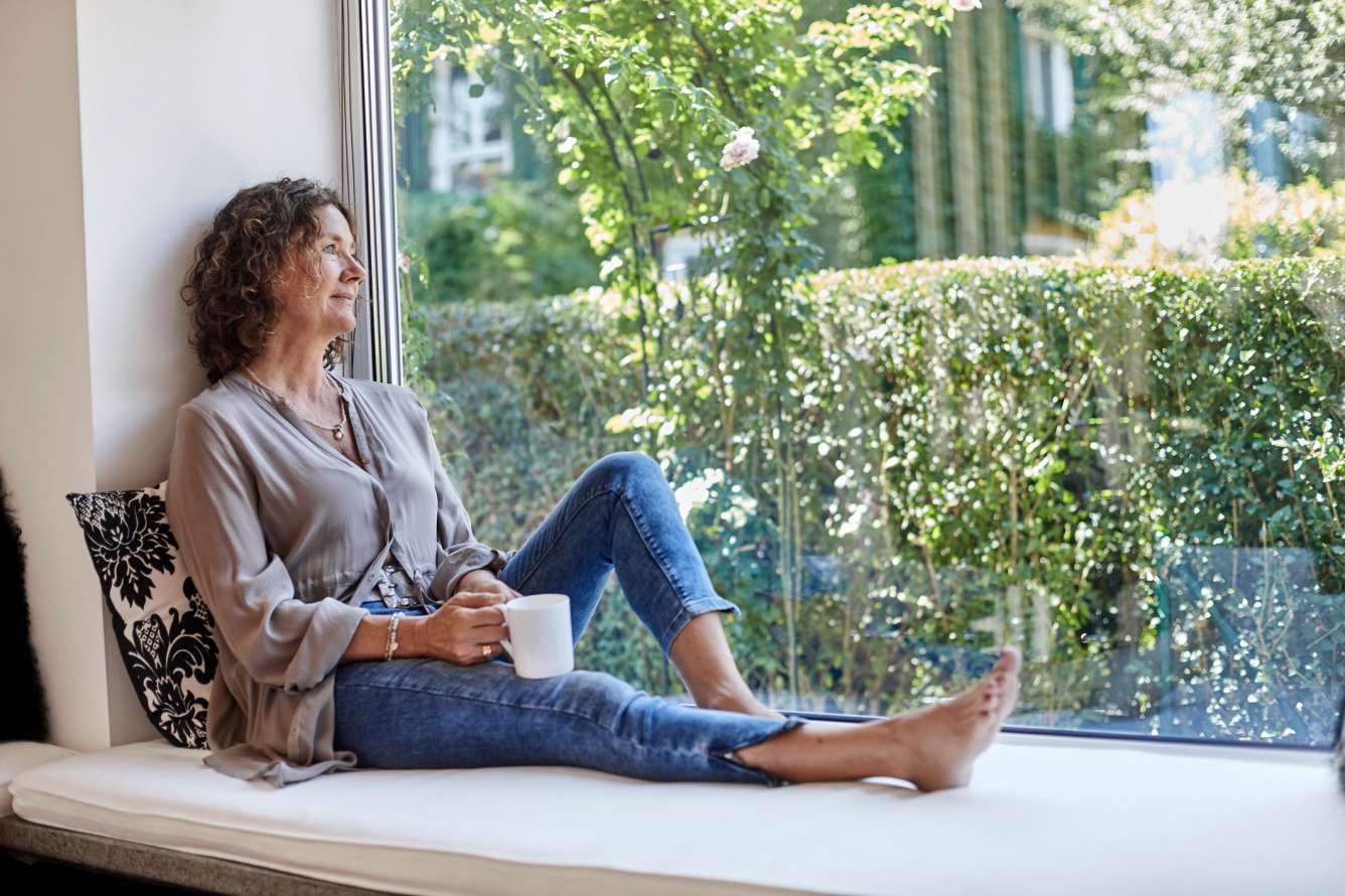 Woman in front of a window
