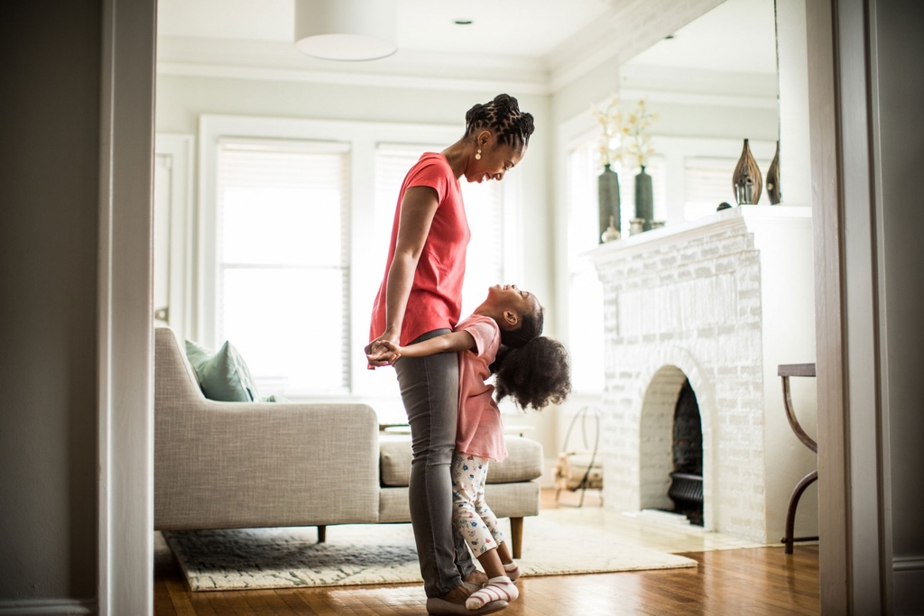 Woman with her child indoors